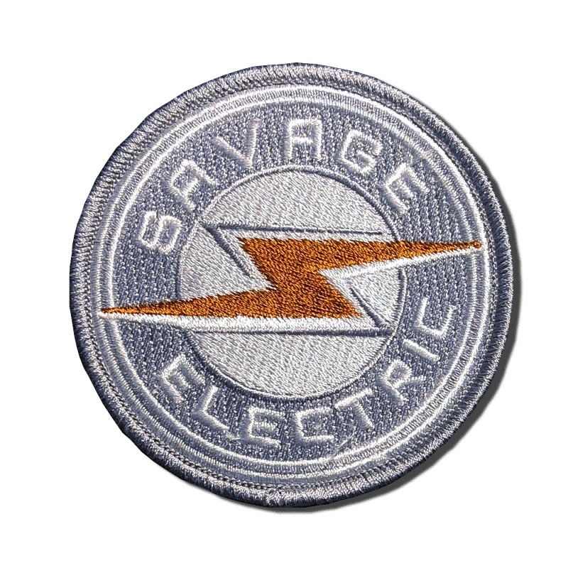 Savage Electric Round Patch. A-B Emblem Photo Gallery Image.